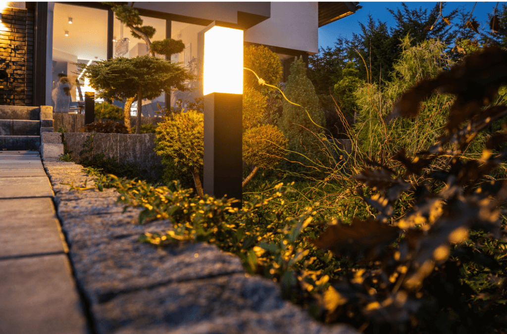 close up image of outdoor lamp leading to walkway of home