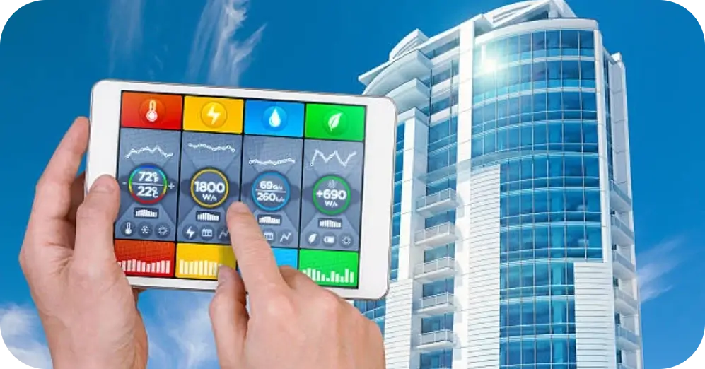 person points to tablet with weather control next to building