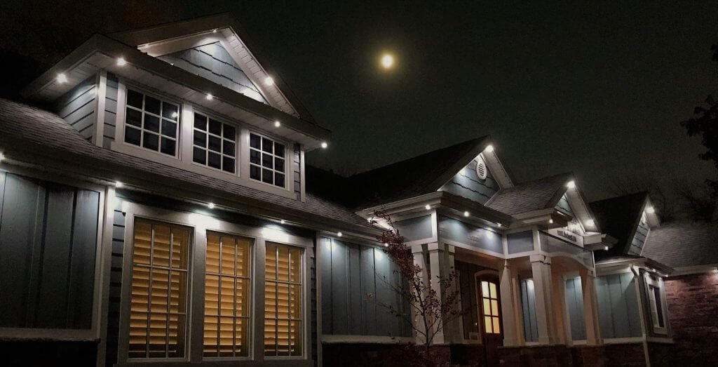 houses with white jellyfish lighting on in the night