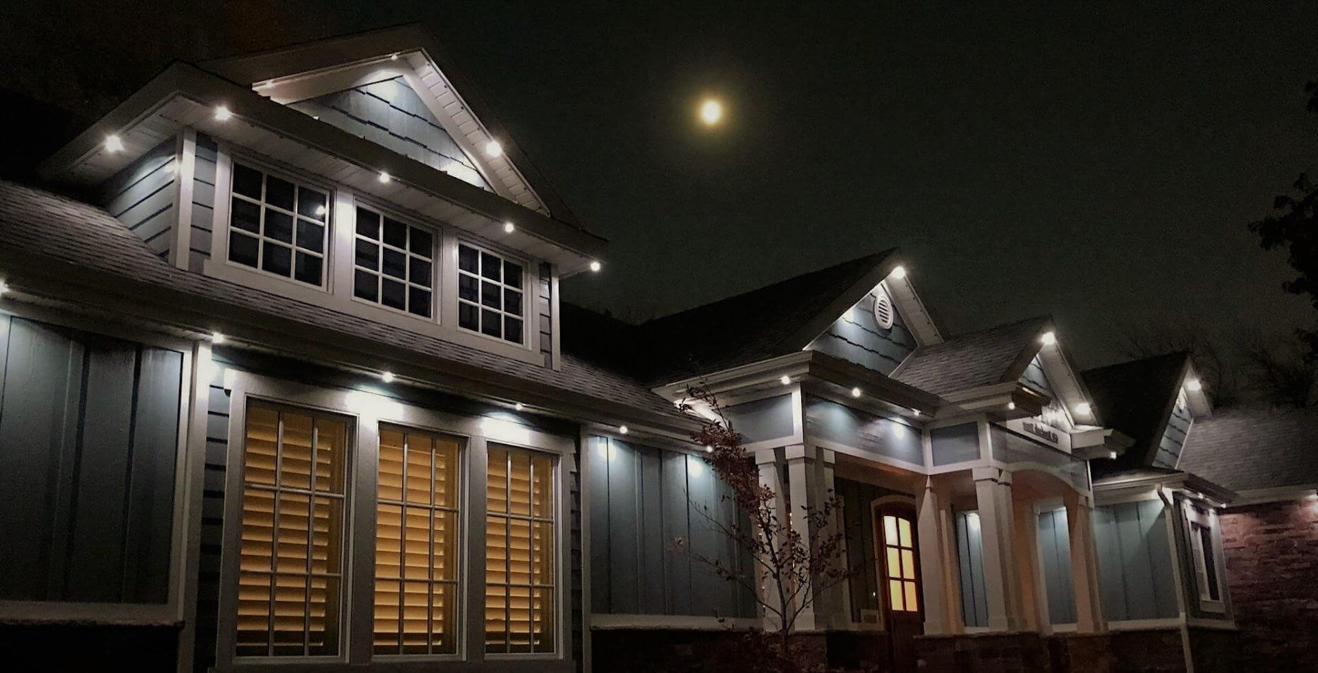 houses with white jellyfish lighting on in the night